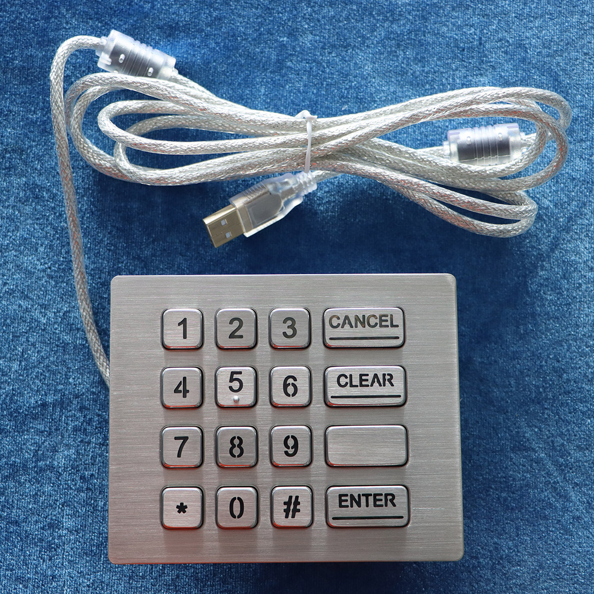 Front view of the Newdesy K-TEK-A120KP-AC-BL-DWP stainless steel industrial keypad with numeric and function keys