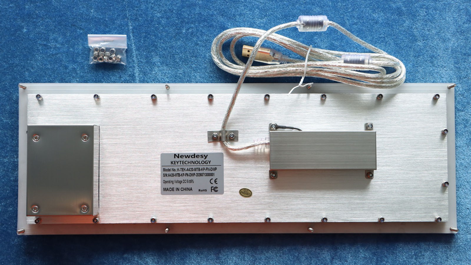 Rear view of the Newdesy K-TEK-A420-MTB-KP-FN-DWP showing threaded mounting studs, rear enclosures and USB cable